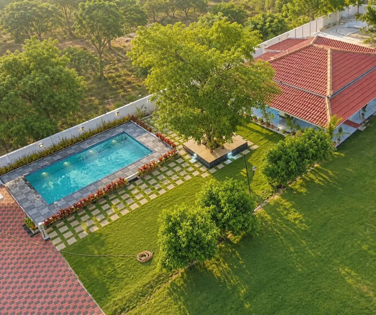 Aerial view of the farmhouse at Aaru Farm House, Shamirpet